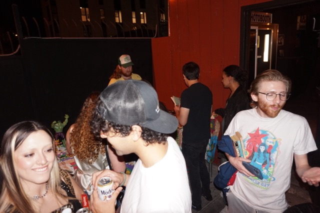 Guests socializing and browsing Ben’s shop